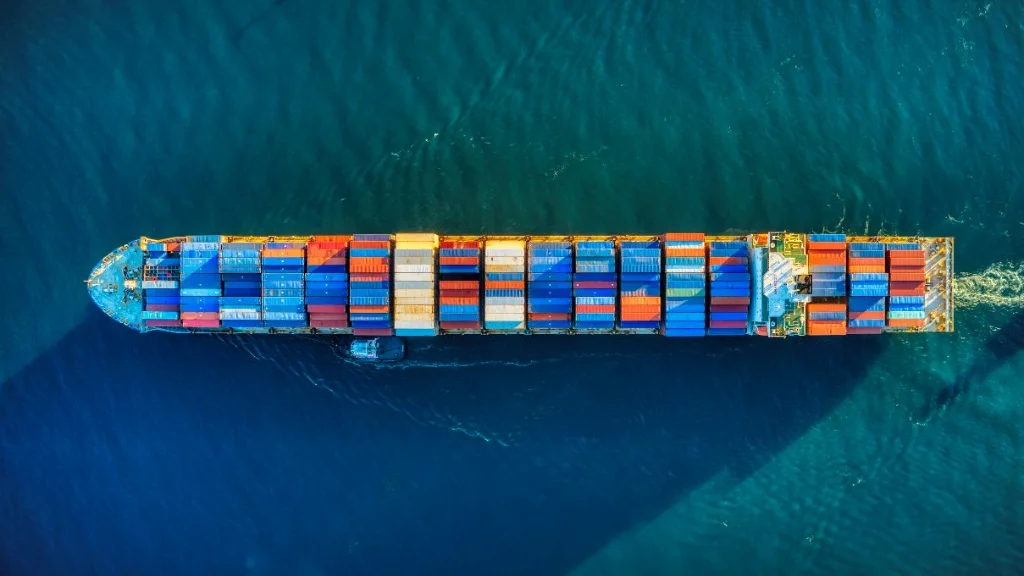 Aerial view of a fully laden container ship under way at sea, the type of vessel covered by the ISPS Code.