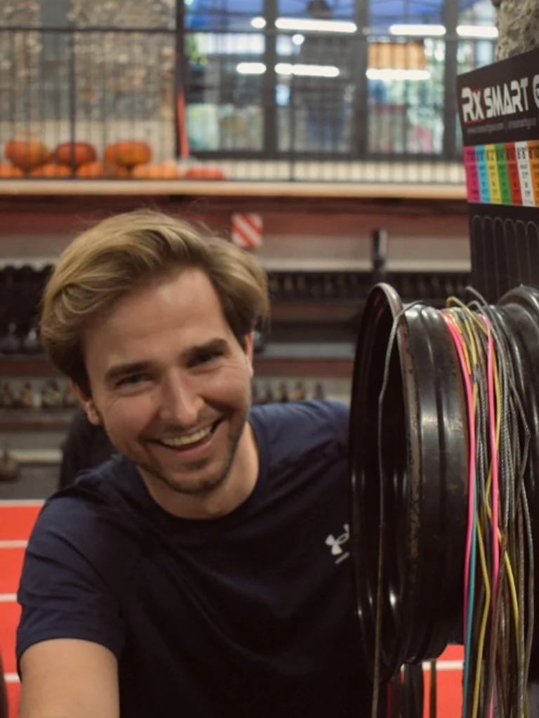 9ID team member smiling in the gym
