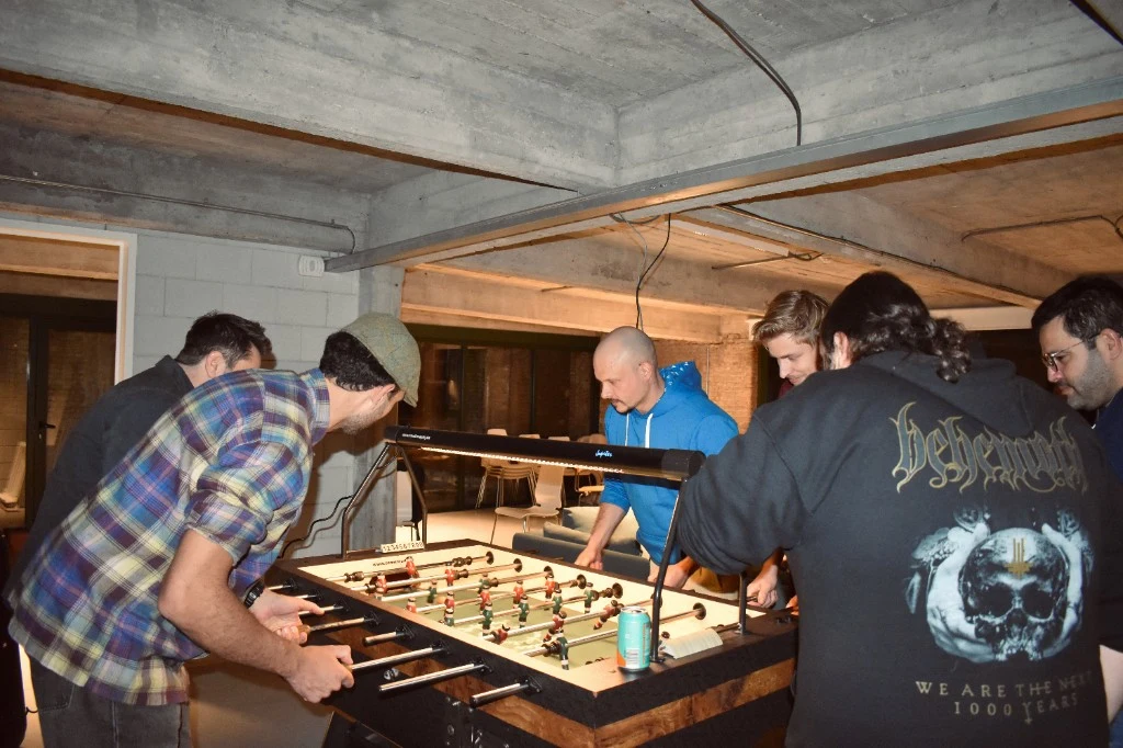 9ID team playing foosball